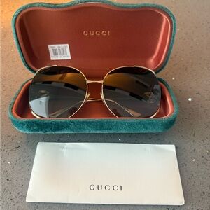 Gucci Women's Sunglasses with Gold Frame and Black Lenses
